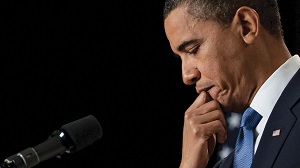 US President Barack Obama listens to a q